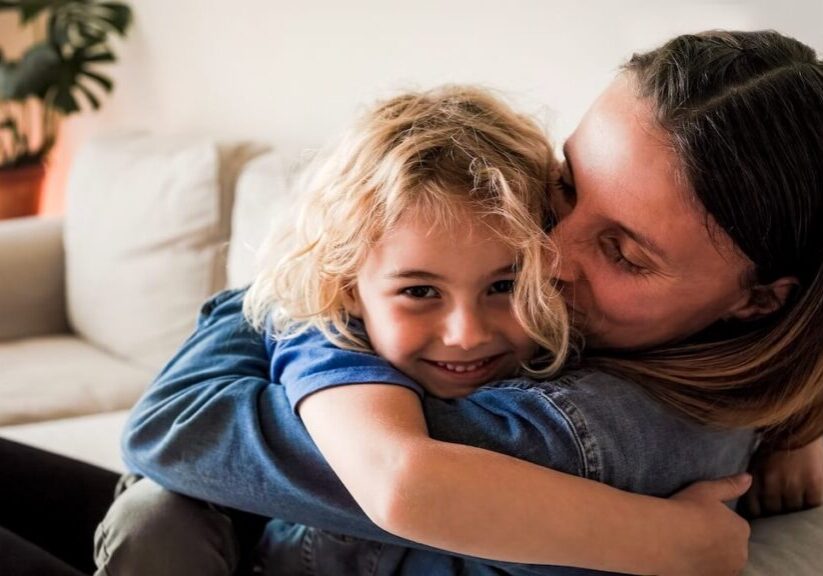 mom and daughter hugging